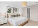 Bright bedroom features neutral decor and a decorative pendant light overhead at 6920 Dappled Oak Way, Orlando, FL 32829