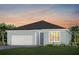 Charming single-story home with a two-car garage and well-maintained landscaping at 6920 Dappled Oak Way, Orlando, FL 32829