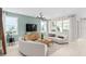 Inviting living room with lots of windows, contemporary decor, and tiled floors at 6920 Dappled Oak Way, Orlando, FL 32829