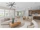 Open-concept living space combining the living room, dining area, and kitchen for a modern feel at 6920 Dappled Oak Way, Orlando, FL 32829