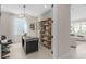 Bright office with a modern glass desk, stylish decor, and large open windows at 6920 Dappled Oak Way, Orlando, FL 32829