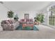 Spacious living room filled with natural light, featuring comfortable sofas and a glass coffee table at 843 Julliard Ct, Orlando, FL 32828