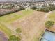 Aerial view of a large soccer field with well-maintained grass and goals, and surrounding neighborhood at 843 Julliard Ct, Orlando, FL 32828