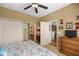 Bedroom with adjoining bathroom and small office area features coastal decor and two closets for storage at 8712 Sw 83Rd Cir, Ocala, FL 34481