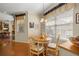 Charming dining area with hardwood floors and natural light offers a cozy space for Gathering meals and gatherings at 8712 Sw 83Rd Cir, Ocala, FL 34481