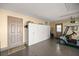 Garage featuring epoxy flooring, built-in storage, and convenient access door at 8712 Sw 83Rd Cir, Ocala, FL 34481