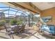 Charming screened-in lanai offering a perfect blend of indoor-outdoor living and space for relaxing at 8712 Sw 83Rd Cir, Ocala, FL 34481