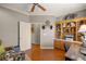 Spacious office with hardwood floors, built-in shelves, and natural light perfect for a home office setup at 8712 Sw 83Rd Cir, Ocala, FL 34481
