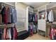 Organized walk-in closet with shelving, hanging rods, window, bench and storage for shoes, clothes and accessories at 8712 Sw 83Rd Cir, Ocala, FL 34481