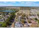 An aerial perspective capturing the property's setting within a community that offers a lake and manicured greenery at 100 Diamond Ridge Blvd, Auburndale, FL 33823