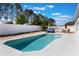 Sparkling in-ground pool with lounge chairs in a private, fenced backyard, perfect for relaxation and outdoor enjoyment at 100 Diamond Ridge Blvd, Auburndale, FL 33823