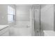 Bathroom featuring a soaking tub, a glass shower and a vanity at 1096 Ballyshannon Pkwy, Orlando, FL 32828