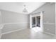 Bright dining room featuring tile flooring, a modern chandelier, and sliding glass doors to the patio at 1096 Ballyshannon Pkwy, Orlando, FL 32828