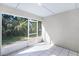 Screened patio featuring tile floor and screened openings with backyard view at 1096 Ballyshannon Pkwy, Orlando, FL 32828