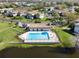 Aerial view of community pool near lake at 112 Windtree Ln # 203, Winter Garden, FL 34787