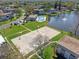 Aerial view showing community pool, basketball court, and fountain in the pond at 112 Windtree Ln # 203, Winter Garden, FL 34787