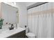 Clean bathroom with modern vanity, gold mirror, and tiled shower/tub combination at 112 Windtree Ln # 203, Winter Garden, FL 34787