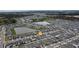 Aerial view of a residential community with houses and ponds at 1171 Lone Palm Way, St Cloud, FL 34771