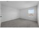 Bedroom with neutral carpet and a window, offering a cozy and well-lit space at 1171 Lone Palm Way, St Cloud, FL 34771