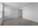 Bright bedroom featuring neutral carpet, closet space, and natural light for a serene atmosphere at 1171 Lone Palm Way, St Cloud, FL 34771