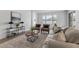 Cozy living room featuring modern furniture, a patterned rug, and plenty of natural light at 1171 Lone Palm Way, St Cloud, FL 34771