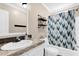 Bathroom featuring neutral walls, tub, and a shower with curtain at 11811 Kijik Trl, Groveland, FL 34736