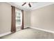 Bedroom featuring neutral walls, carpet, and natural light at 11811 Kijik Trl, Groveland, FL 34736