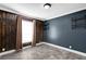 Bedroom featuring wood accent wall, and light wood-look floors at 11811 Kijik Trl, Groveland, FL 34736