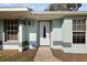 Close-up of the front door with decorative details and a keypad lock system at 12419 Eryn Ct, Clermont, FL 34711