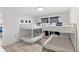 Bright bedroom featuring two sets of white bunk beds perfect for or guests at 1244 Spinnaker Dr, Lakeland, FL 33805