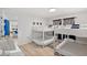 Bright bedroom featuring two sets of white bunk beds adjacent to the living area at 1244 Spinnaker Dr, Lakeland, FL 33805