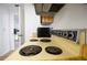 Kitchen stove featuring electric elements, dials, and a compact microwave, showcasing a functional cooking area at 1244 Spinnaker Dr, Lakeland, FL 33805