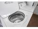 Top-loading washing machine with an open lid, showing the stainless steel drum at 1244 Spinnaker Dr, Lakeland, FL 33805