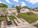 Townhome featuring a manicured lawn and a long driveway at 1269 Winter Green Way, Winter Garden, FL 34787