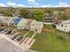 Aerial view of townhome featuring a manicured lawn and mature trees at 1269 Winter Green Way, Winter Garden, FL 34787