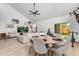 Airy living room with light flooring, an entertainment center, and sliding glass doors to backyard at 1269 Winter Green Way, Winter Garden, FL 34787