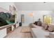 Cozy living room features neutral tones, lots of natural light, and comfortable seating area at 1269 Winter Green Way, Winter Garden, FL 34787