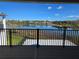 Balcony view of a serene lake, blue sky and greenery at 13217 Tollcross Way, Winter Garden, FL 34787