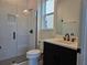 Modern bathroom featuring a glass-enclosed shower, sleek vanity, and contemporary fixtures at 13217 Tollcross Way, Winter Garden, FL 34787