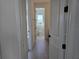 Hallway featuring view to the bathroom at 13217 Tollcross Way, Winter Garden, FL 34787