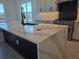 Kitchen island featuring a white countertop and gray accents at 13217 Tollcross Way, Winter Garden, FL 34787