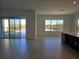 Spacious living room with lots of natural light and a view of the backyard pool at 13217 Tollcross Way, Winter Garden, FL 34787