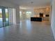 Bright living space with open floor plan leading to the kitchen and pool area at 13217 Tollcross Way, Winter Garden, FL 34787