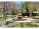 Outdoor water fountain sitting on a well maintained grassy area with benches and shade at 1407 Leitrim Loop, Apopka, FL 32703