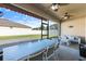 Relaxing screened patio with a dining table and comfortable seating, perfect for outdoor enjoyment at 1407 Leitrim Loop, Apopka, FL 32703