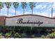 Stone Breckenridge community sign surrounded by maintained bushes and tall palm trees at 1407 Leitrim Loop, Apopka, FL 32703