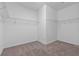 Walk-in closet features carpet floors and wire shelving for optimal organization at 1407 Leitrim Loop, Apopka, FL 32703