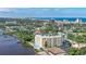 Aerial view of the condominium building and waterfront, showing the beach in the distance at 145 N Halifax Ave # 601, Daytona Beach, FL 32118