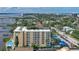 Aerial view of the condominium building near the Halifax River and lush neighborhood at 145 N Halifax Ave # 601, Daytona Beach, FL 32118