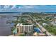 An aerial view of the condominium building and the scenic Halifax River and surrounding cityscape at 145 N Halifax Ave # 601, Daytona Beach, FL 32118